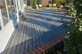 Custom composite decking, staggered deck boards with double bordered trim.