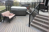 Stairs and composite deck with railings.
